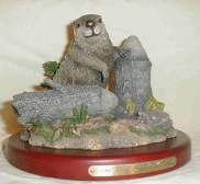 Figurine featuring a Beaver and a log